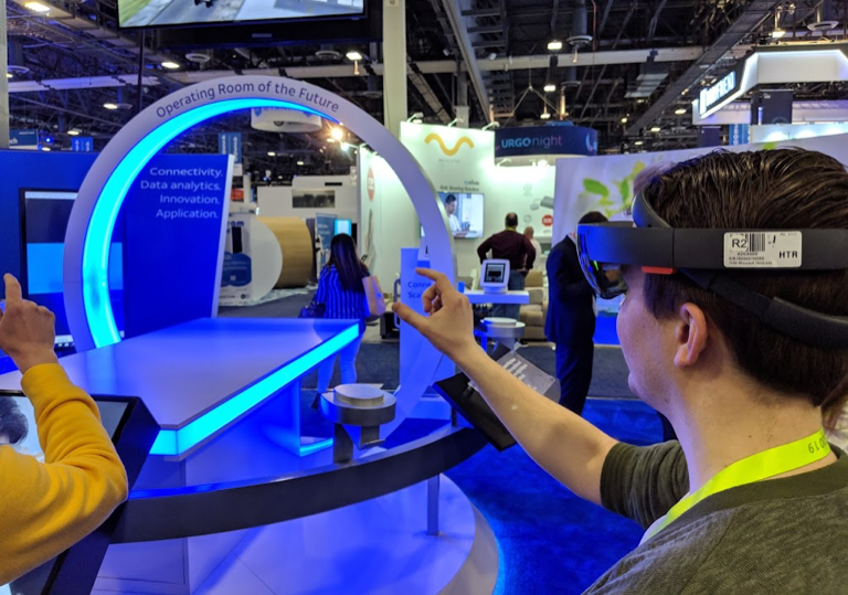 CES2019-1 Man wearing virtual reality goggles at conference booth